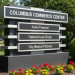 A modern, multi-tenant monument sign at a Columbus commercial property showing consistent branding.